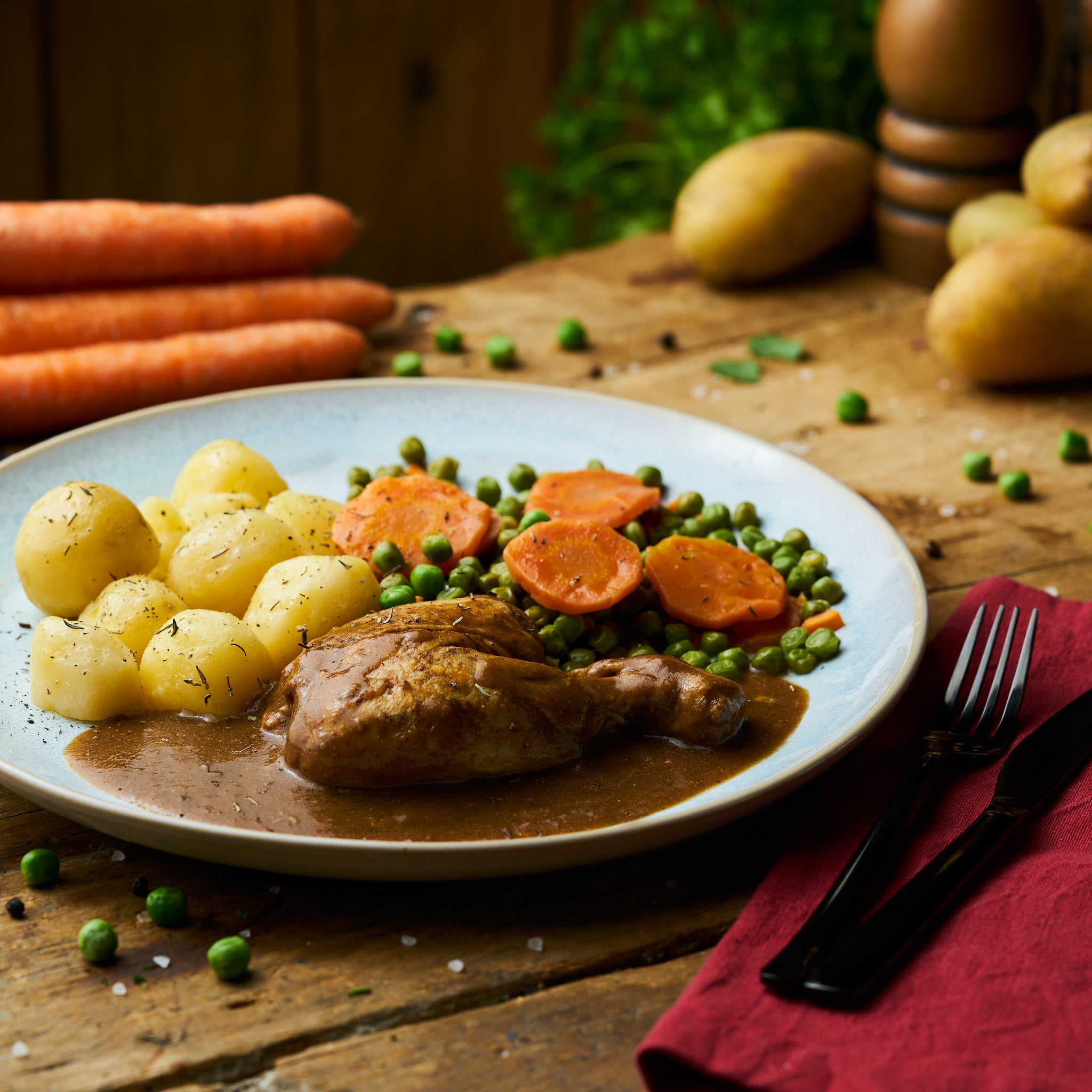 Hähnchenkeule in Zitronen-Rosmarinsauce mit Erbsen-Möhrengemüse und Butterkartoffeln - freshfoodz